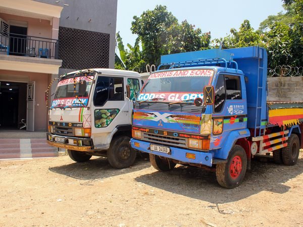 Cooperative trucks parked outside the stores